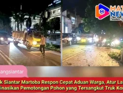 Polsek Siantar Martoba Respon Cepat Aduan Warga, Atur Lalin dan Koordinasikan Pemotongan Pohon yang Tersangkut Truk Kontainer